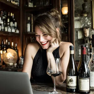 Wine blogger Lisa A. enjoying a tasting with the drip-free DROPSAVER® wine pourer — stylish, practical, and reusable.