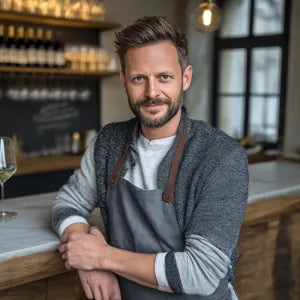 Restaurateur Markus C. using the DROPSAVER® wine pourer — elegant, clean pouring that impresses guests.